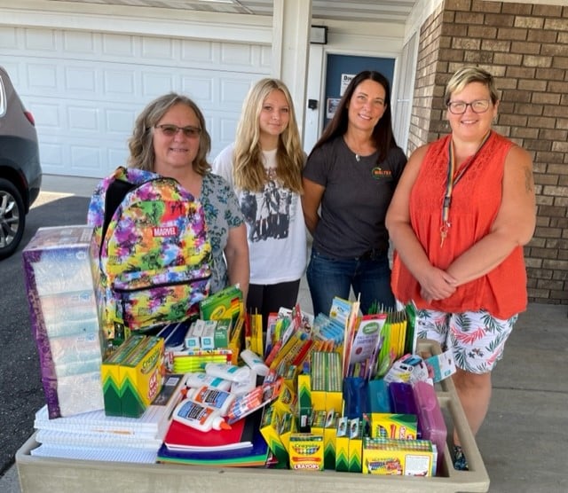 Four Walters Employees At Kids Drive Event