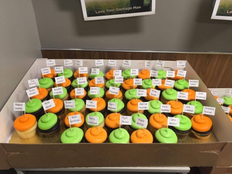 Orange And Green Frosted Cupcakes At Company Event