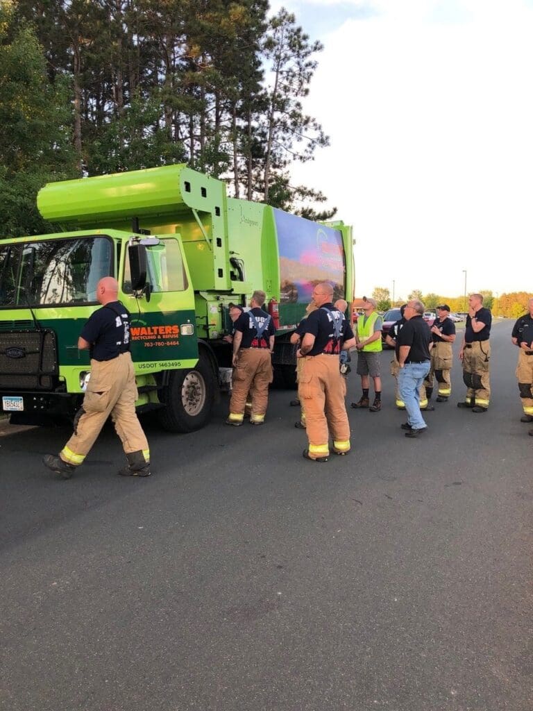 Fire Fighters Checking Out Walters Truck At Community Event