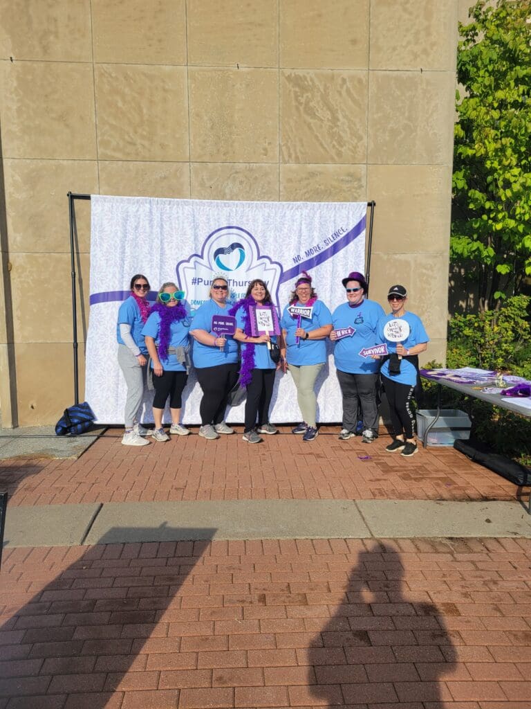 Seven Walters Employees With Fun Props Posing For A Photo