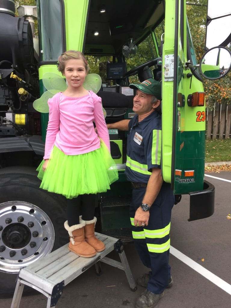 Little Kid Dressed Up As A Fairy Posing With Walters Truck