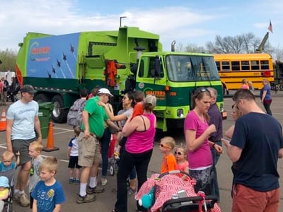Families Gathering Around Truck At Community Event